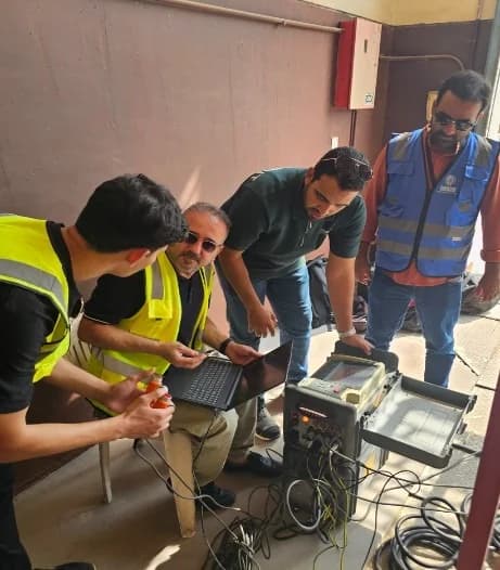 Engineering team reviewing field test evidence